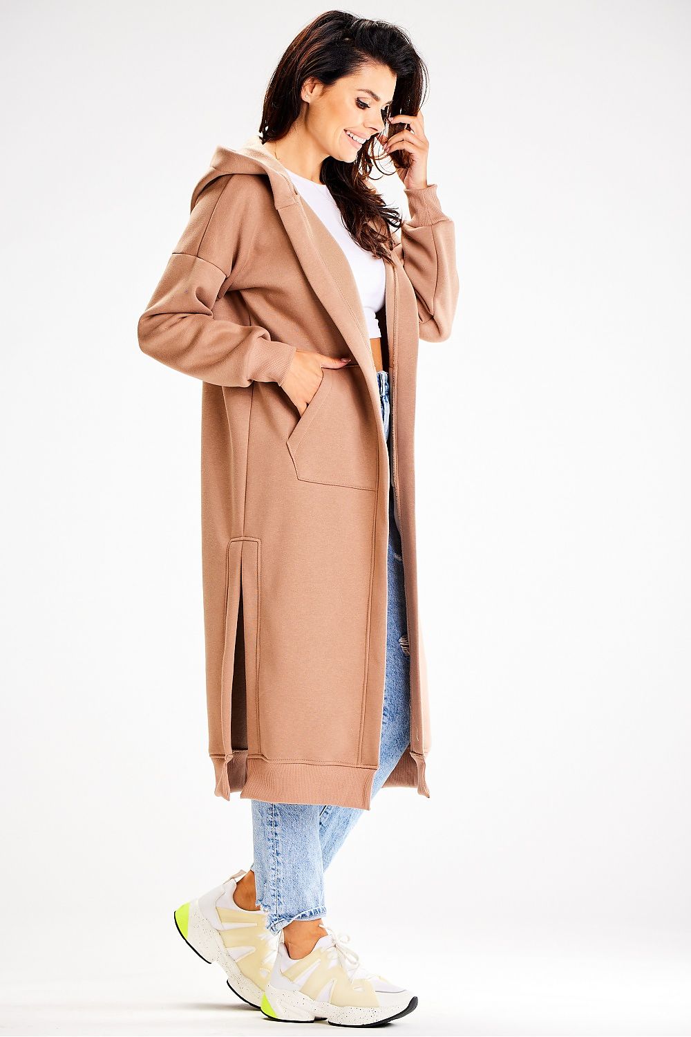 Luxurious Awama long loose-fitting sweatshirt featuring a stylish hood, practical front pockets, and elegant side slits, crafted for ultimate comfort and chic wear.