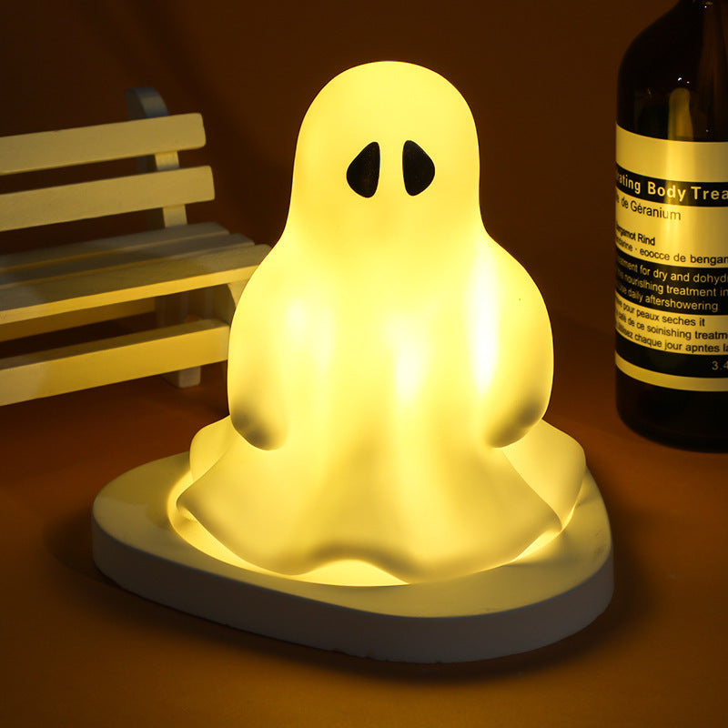 Halloween LED Glowing Cute Small Night Lamp depicting a classic ghost shape, shining softly for an enchanting Halloween atmosphere.