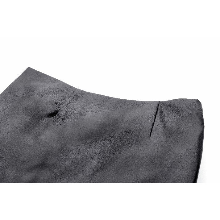 The Dark in Love Chaos Reign Faux Leather Mini Skirt styled with fishnets and platform boots, embodying rebellious street style and gothic elegance.