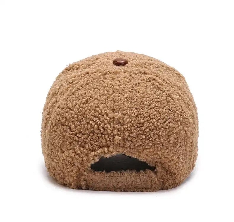 Luxurious stylish fleece baseball cap featuring elegant 'C' logo detail, available in sophisticated cream, tan, and black colour options, designed for a perfect fit for most head sizes.