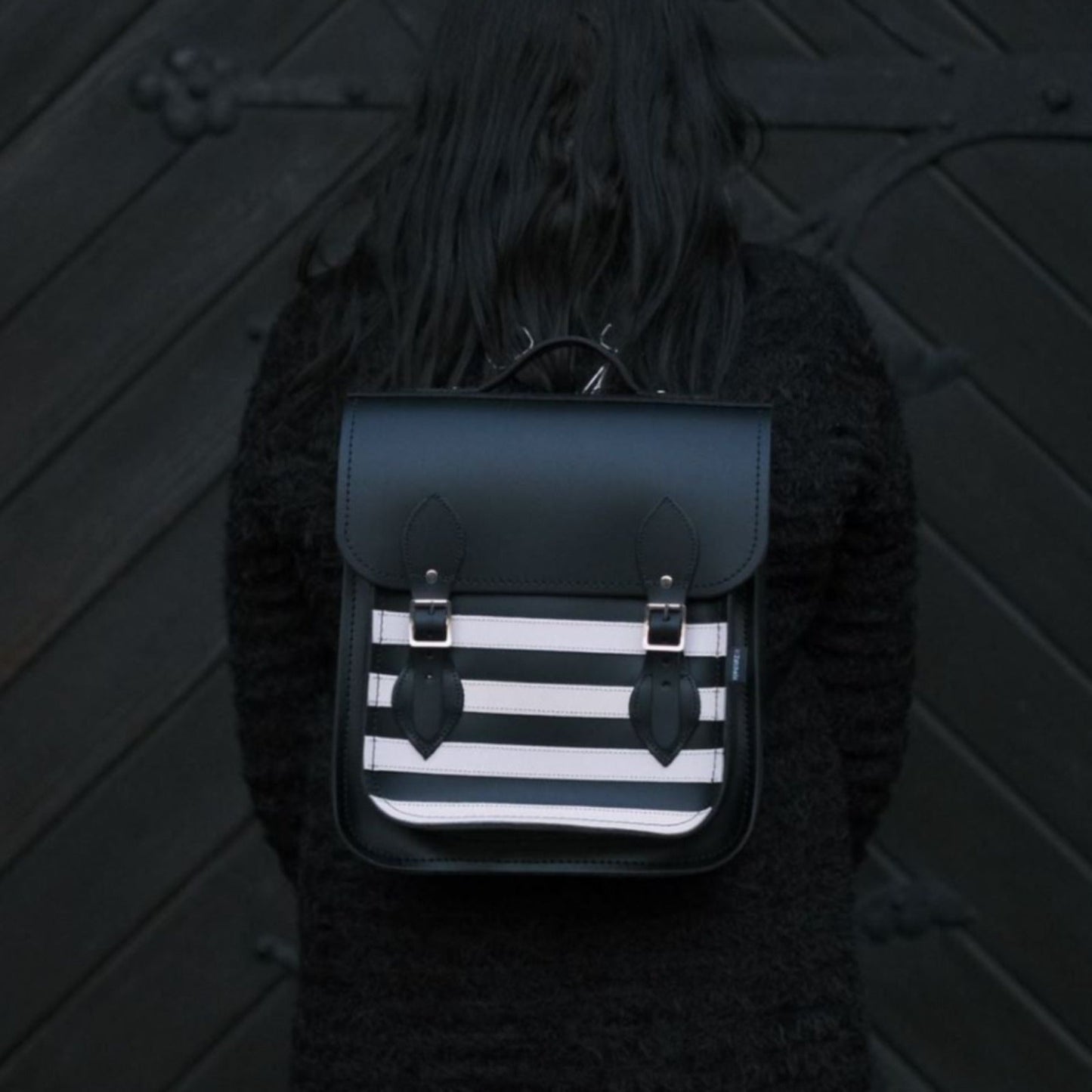 Handmade Gothic Leather City Backpack in striking black and white stripes, perfect for modern urbanites, showcasing premium craftsmanship and versatility for carrying laptops and tablets.