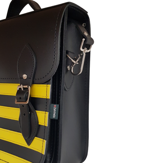 Luxury Handmade Leather City Backpack in Gothic Yellow and Black Stripes, showcasing its unique design, handcrafted quality, and elegant details like silver nickel buckles against a sleek black interior.