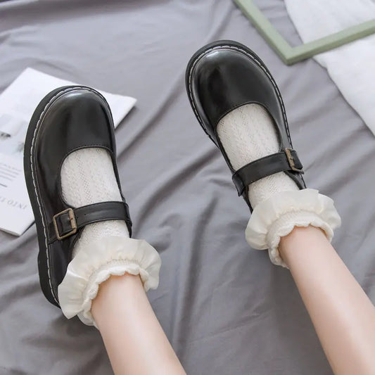 Lolita Style Women's Frilled Socks showcased with black leather Mary Jane shoes, featuring delicate white lace design, emphasizing elegant comfort and Japanese Kawaii aesthetics.