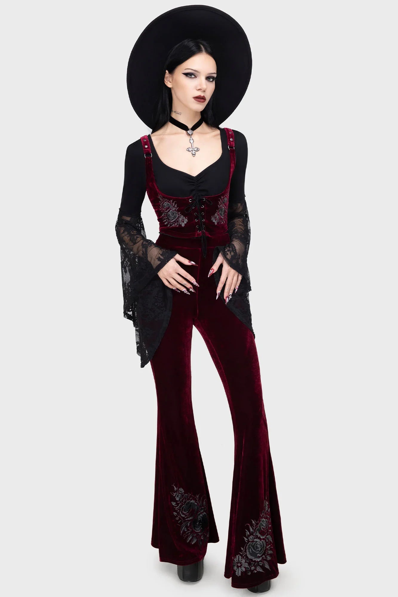 Stylish Killstar A Devil's Rose Flares with dramatic flared hems and elastic waistband, beautifully showcasing the fitted silhouette and rich velvet texture.