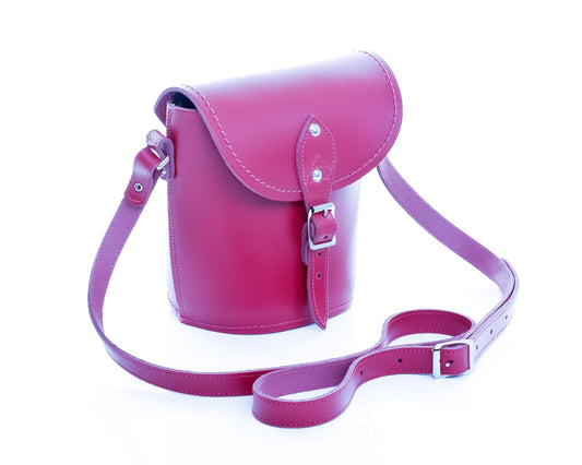 Luxury Handmade Leather Barrel Bag in vibrant magenta, showcasing premium craftsmanship and elegant design, perfect for stylish accessorising.