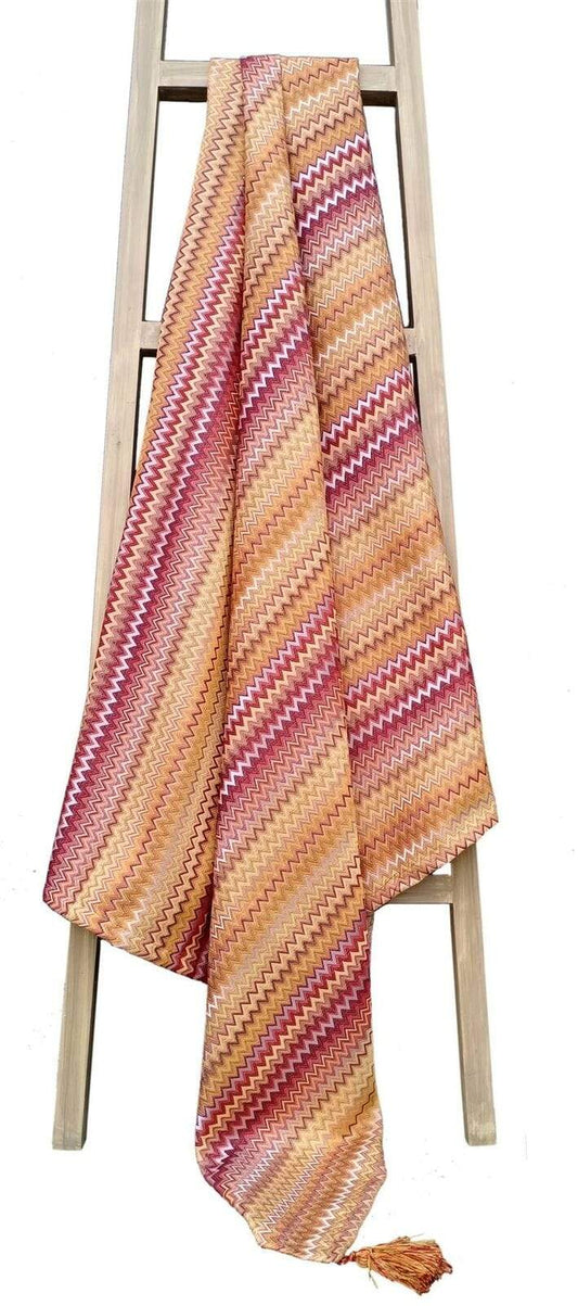 The Mia Bohemian Throw Blanket adorned with detailed tassels, showcasing its stylish bohemian pattern, ideal for adding warmth and elegance to any living space.