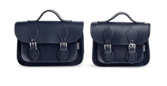 Stylish navy leather micro satchel open, revealing spacious interior, perfect for carrying smartphones and small essentials, a luxurious accessory by Zatchels.