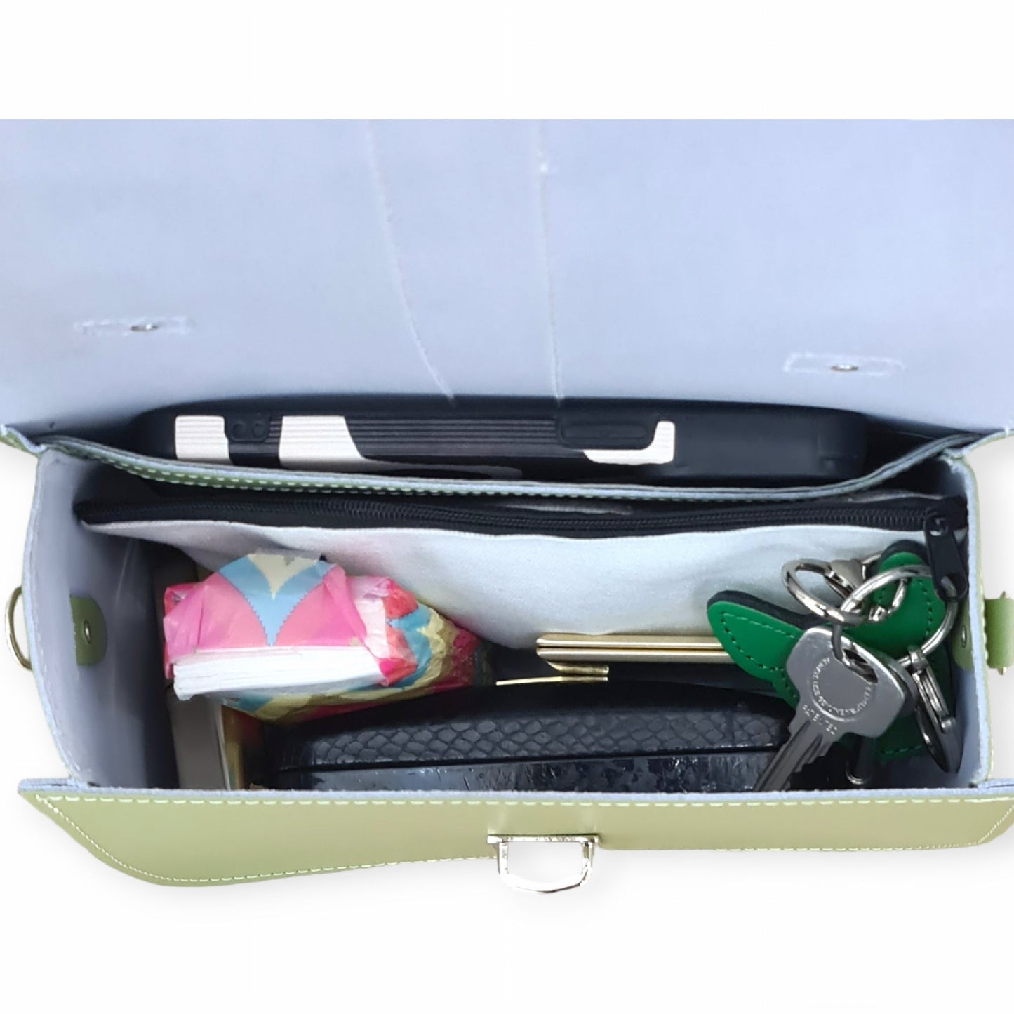 Versatile carrying options of the Olympia Handmade Leather Handbag with grab handle and adjustable crossbody strap for modern elegance.