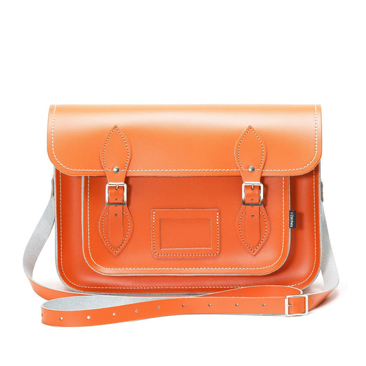 Customizable Orange Leather Satchel displayed with adjustable strap, perfect for both shoulder and cross-body wear.