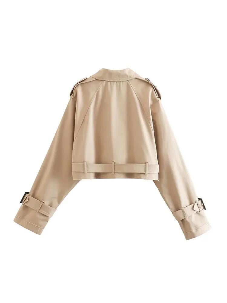 Luxurious beige oversized crop trench coat, featuring double-breasted fastening and a stylish belted hem, perfect for sophisticated layering.