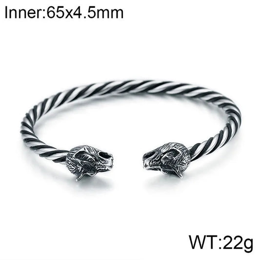 Stylish depiction of a skull-themed Men's bangle bracelet in high-quality stainless steel, ideal for rock and punk fashion enthusiasts.