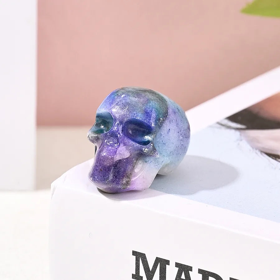 Stylish natural stone skull decoration in sophisticated sky blue and purple hues, ideal for indoor settings and family gatherings.