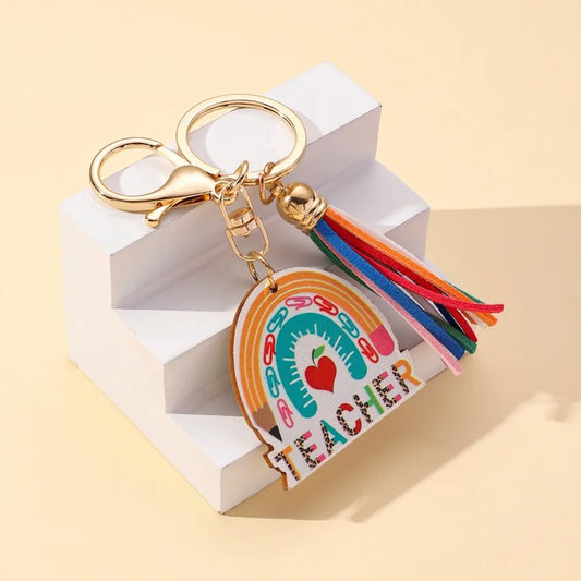 Elegant modern wooden keychain featuring a vibrant rainbow tassel design, perfect for Teachers' Day gifting.