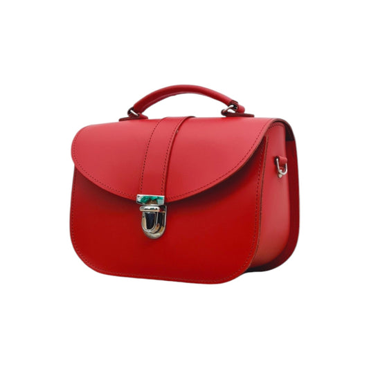 The Olympia Handmade Leather Handbag in vibrant Pillar Box Red, featuring an adjustable crossbody strap and stylish top handle.