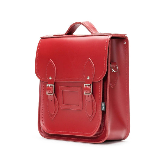 Compact Red Leather Backpack showcasing adjustable straps and versatile styling options, perfect for tablets and laptops up to 13 inches.