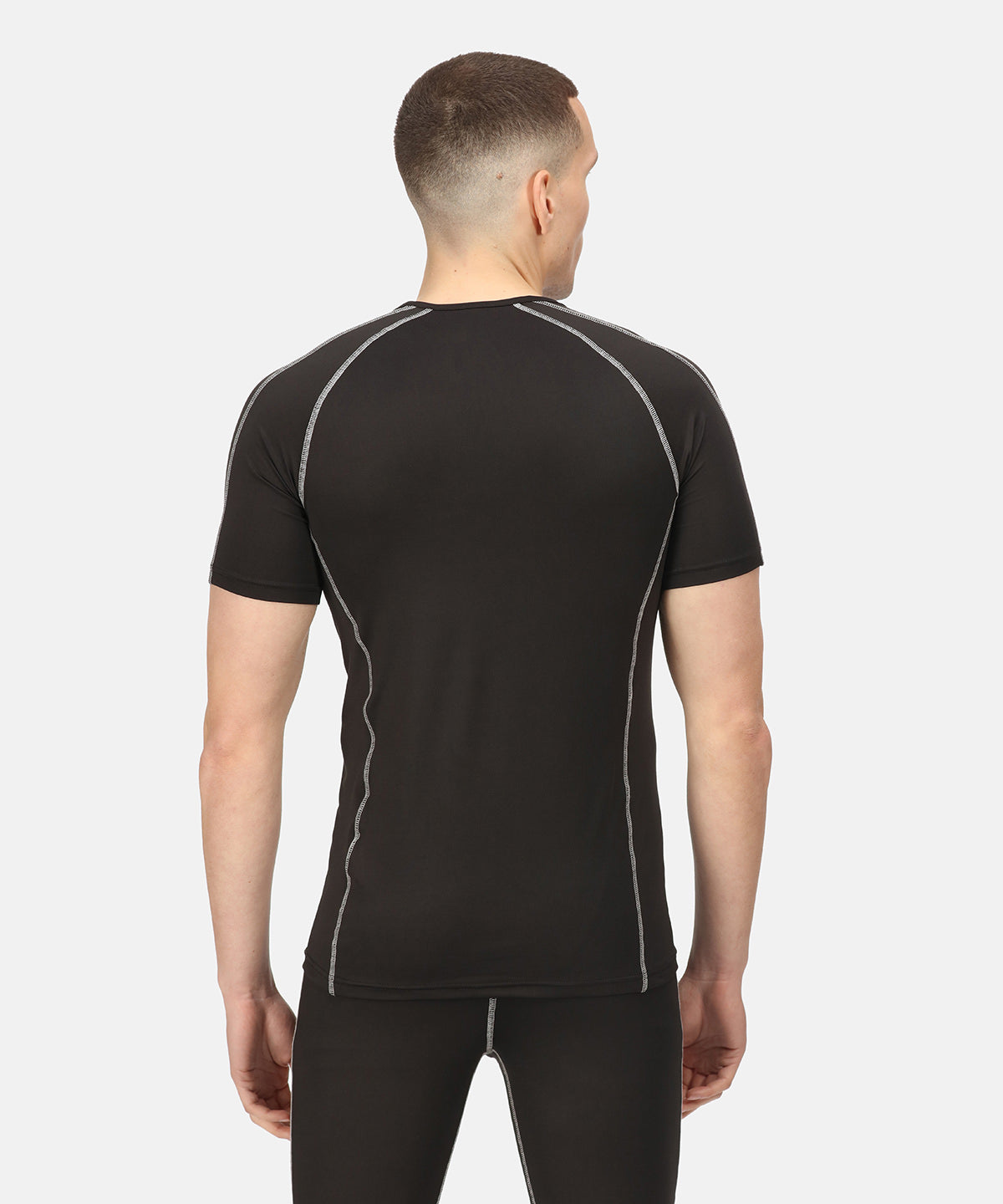Model wearing Luxury Regatta Professional Pro Short Sleeve Baselayer, demonstrating its perfect fit and stylish look in various sizes.