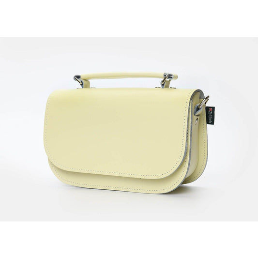 Versatile Aura Luxury Handbag featuring detachable strap and top carry handle for stylish clutch or crossbody wear.