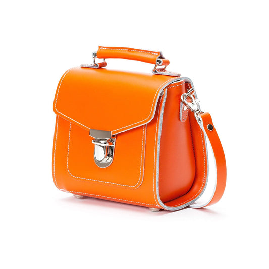 Vibrant orange Sugarcube handbag displayed in Plus size, highlighting its unique shape and chic appeal, perfect for elevating any outfit.