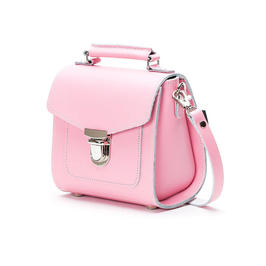Close-up of the Handmade Pastel Pink Leather Sugarcube Handbag's secure push-lock closure and premium leather texture, embodying sophistication and timeless fashion appeal.