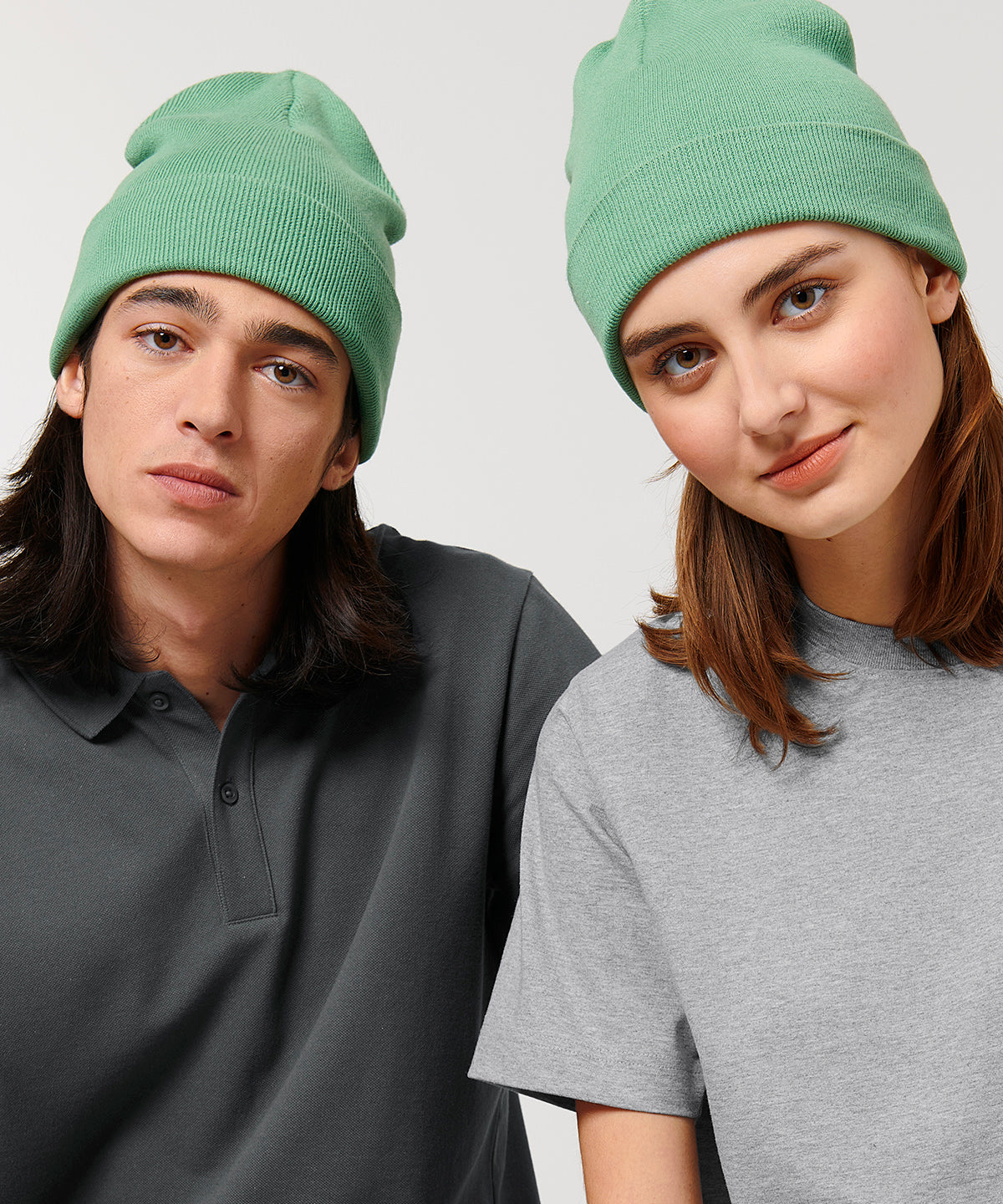 Luxury unisex ribbed beanie made from organic cotton and recycled polyester, featuring a foldable brim, available in various elegant colours.