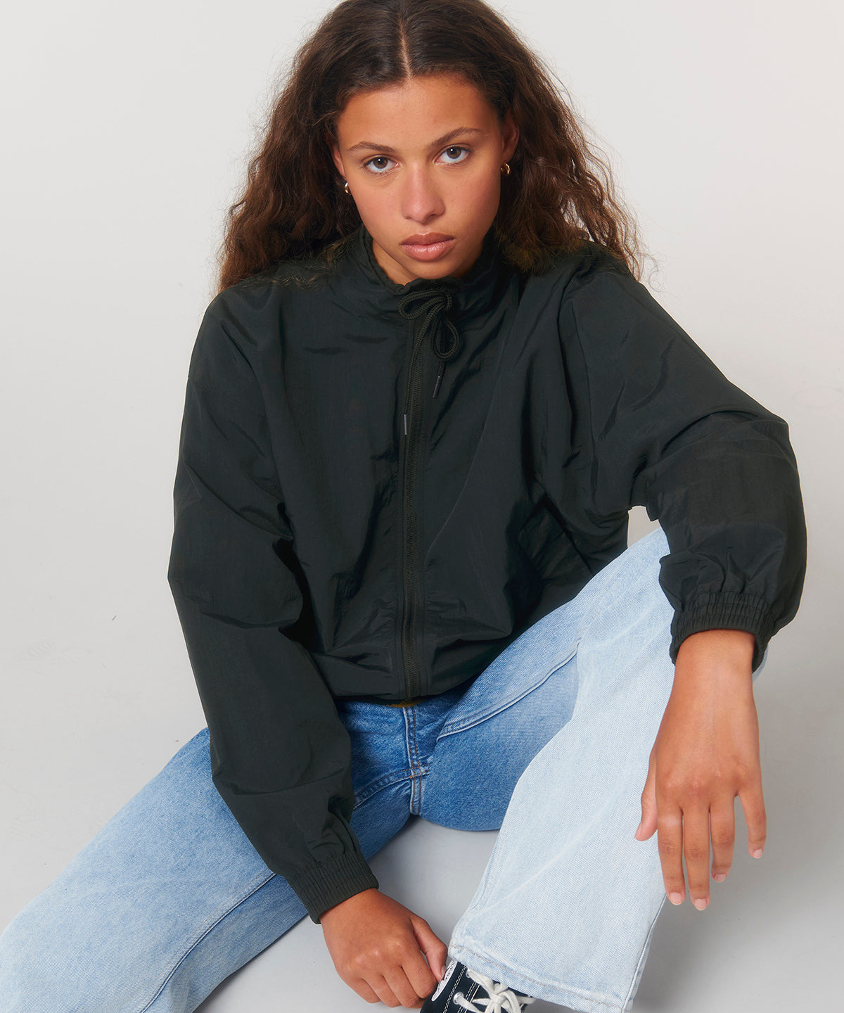 Stylish unisex recycled nylon tracksuit top showcasing a refined silhouette, perfect for sporty and upscale casual wear, exuding sophistication.