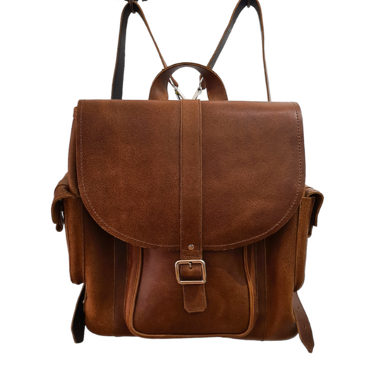 Elegant tan leather backpack featuring practical zipped pockets and a sophisticated magnetic clasp, perfect for both casual and formal occasions.