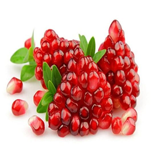 Luxurious pomegranate seeds glistening with a rich ruby hue, nestled among vibrant green leaves, showcasing the delicious and nutritious treasures of nature.