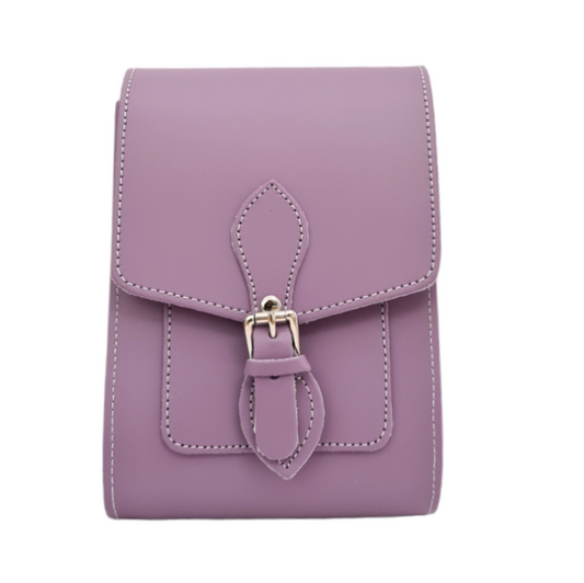 Close-up of the elegant magnetic closure and adjustable strap of the pastel violet leather festival phone bag, highlighting fine craftsmanship and modern design.