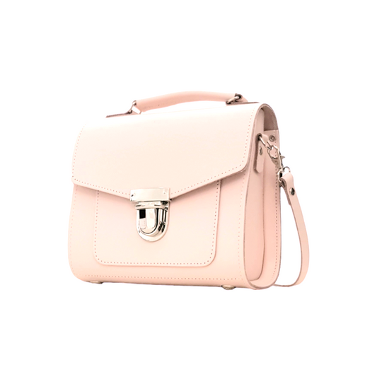 Luxurious Handmade Leather Sugarcube Handbag in Cherry Blossom, showcasing delicate pale pink leather design and trendy push-lock closure, perfect for enhancing elegant outfits.
