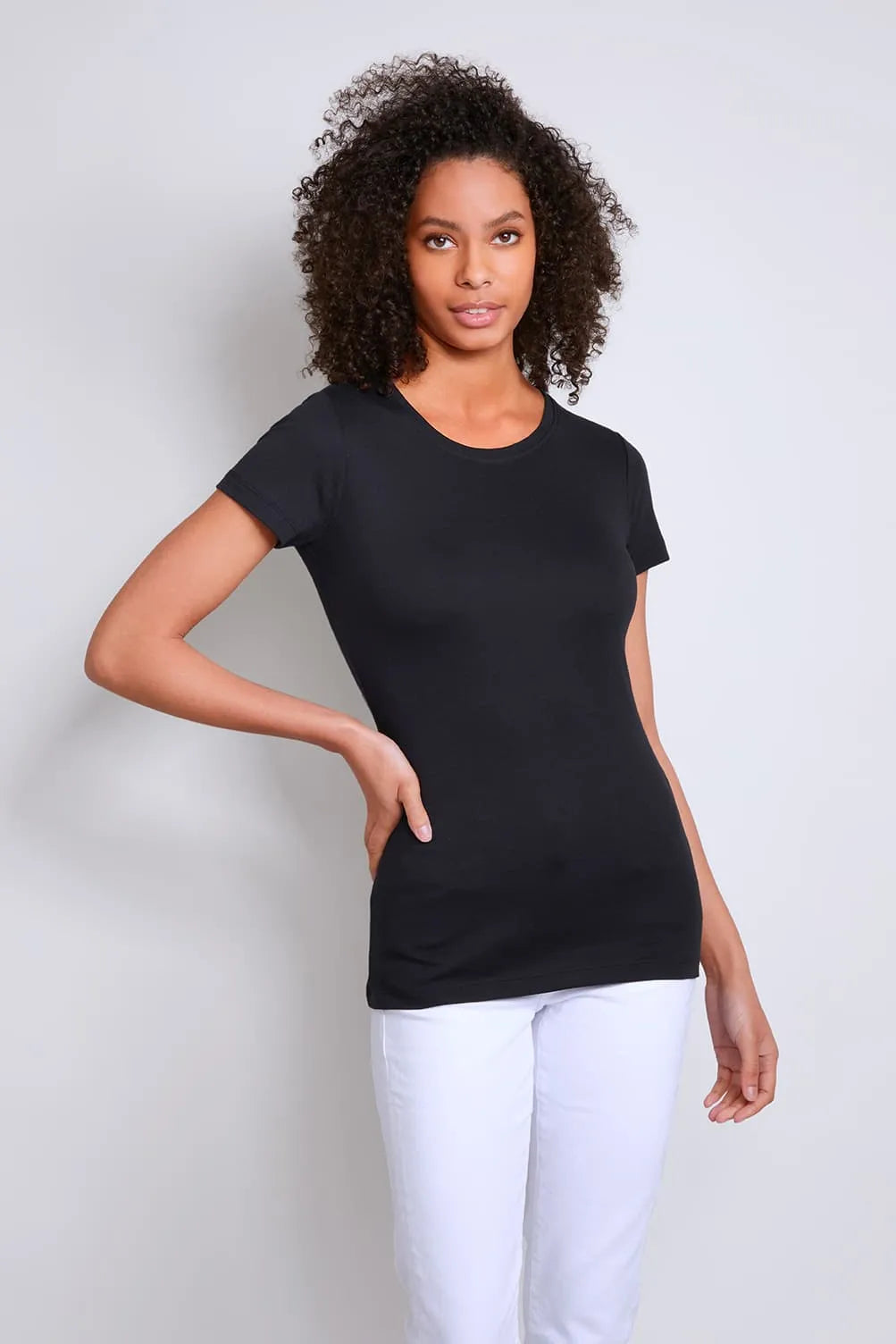 Stylish women's short sleeve crew neck t-shirt available in UK sizes 8-18, elegantly styled with jeans and accessories, representing versatile fashion for chic looks.