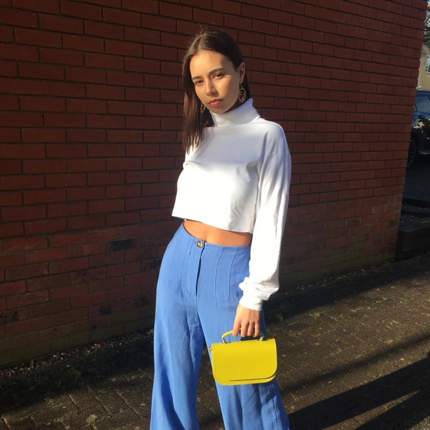 Aura Pastel Pink Leather Handbag in refined settings, demonstrating versatility as a chic crossbody or sophisticated clutch for evening events.