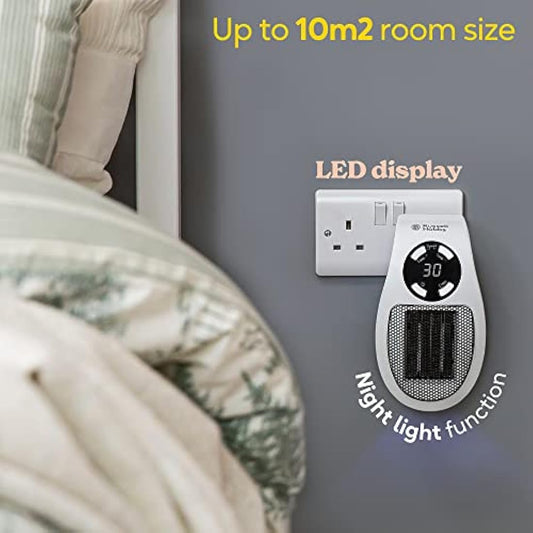 Luxury close-up of the LED display on a Russell Hobbs 500W ceramic plug heater, showing heating settings with quiet night-light function