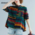 Explore the latest trendy women's tops with this stylish multicoloured striped blouse, perfect for a chic summer look.