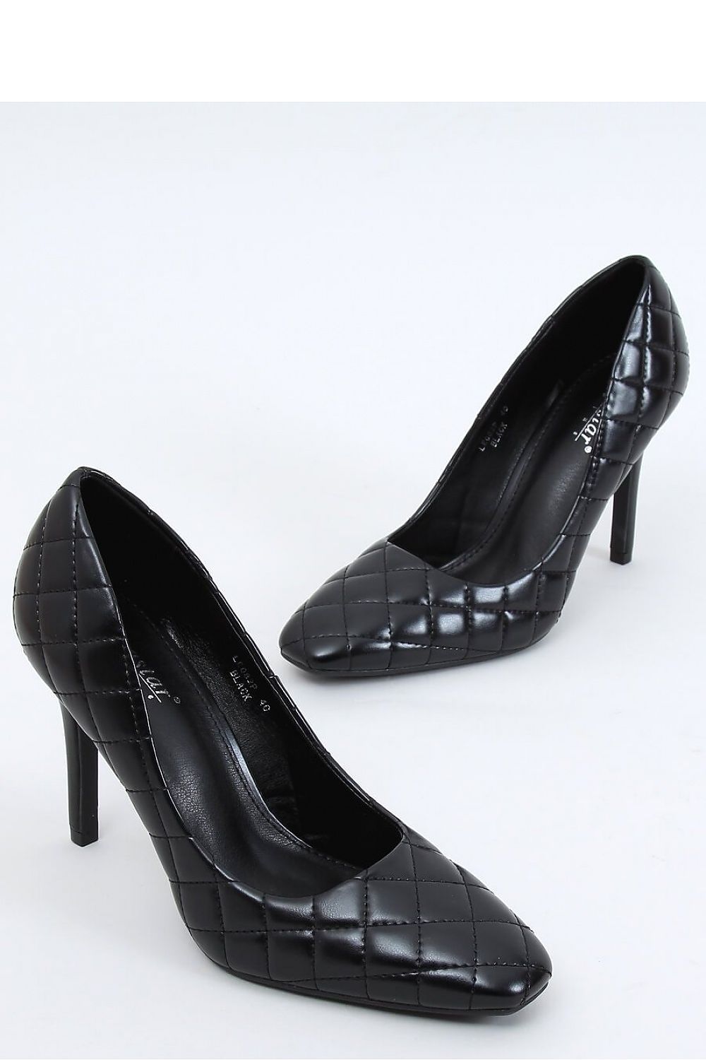 Elegant black pumps featuring a glossy quilted design, high stiletto heel, and sleek profile, perfect for sophisticated occasions.