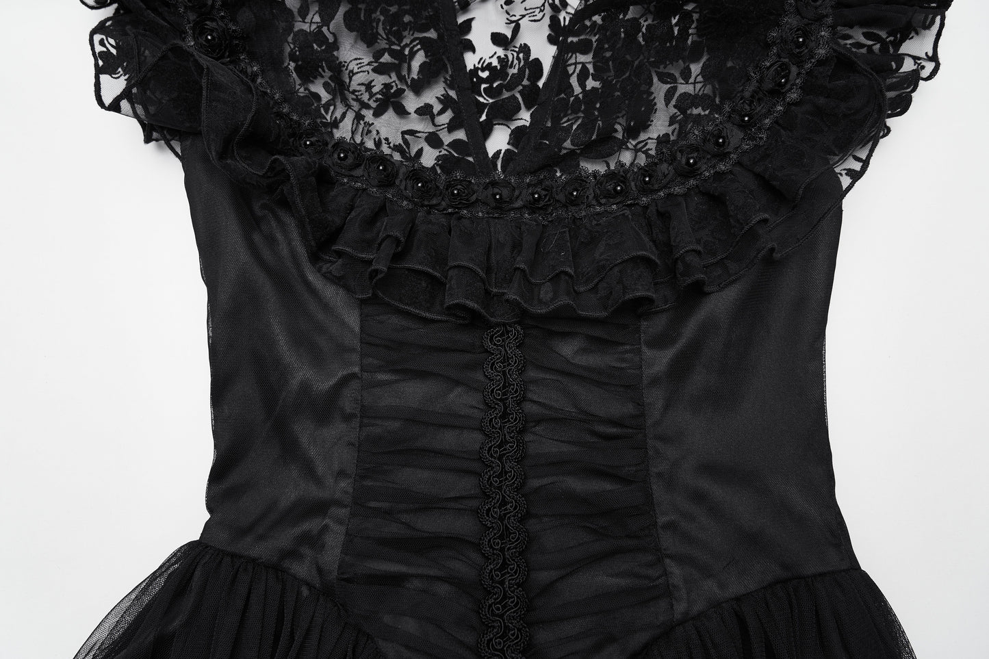 Flowing sheer skirt of the Punk Rave Seraphina Dress, adorned with delicate lace ruffles and rose embellishments, enhancing the movement and drama.