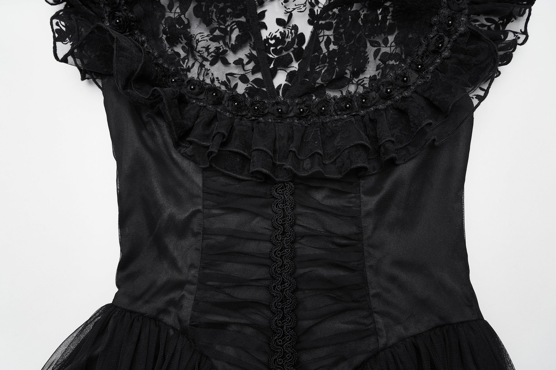 Flowing sheer skirt of the Punk Rave Seraphina Dress, adorned with delicate lace ruffles and rose embellishments, enhancing the movement and drama.