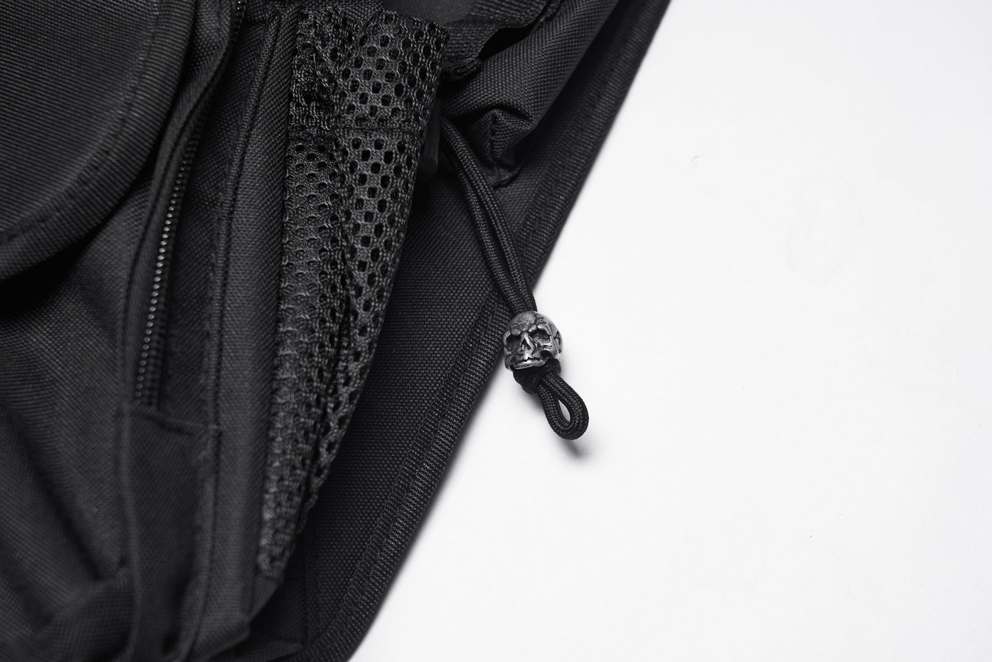 Close-up view of Punk Rave tactical goth leg bag featuring heavy-duty rivets, showcasing the intricate skull detailing for a luxury punk-inspired look.