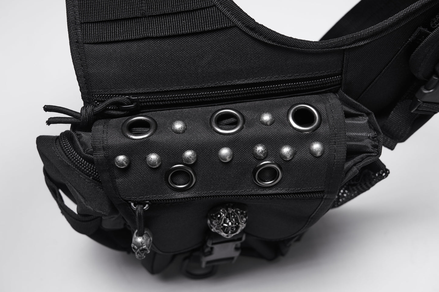 Luxury Punk Rave Tactical Goth Canvas Skull Waist-Leg Bag showcasing a rugged design with intricate skull emblems and multiple functional pockets, perfect for urban exploration and gothic fashion.