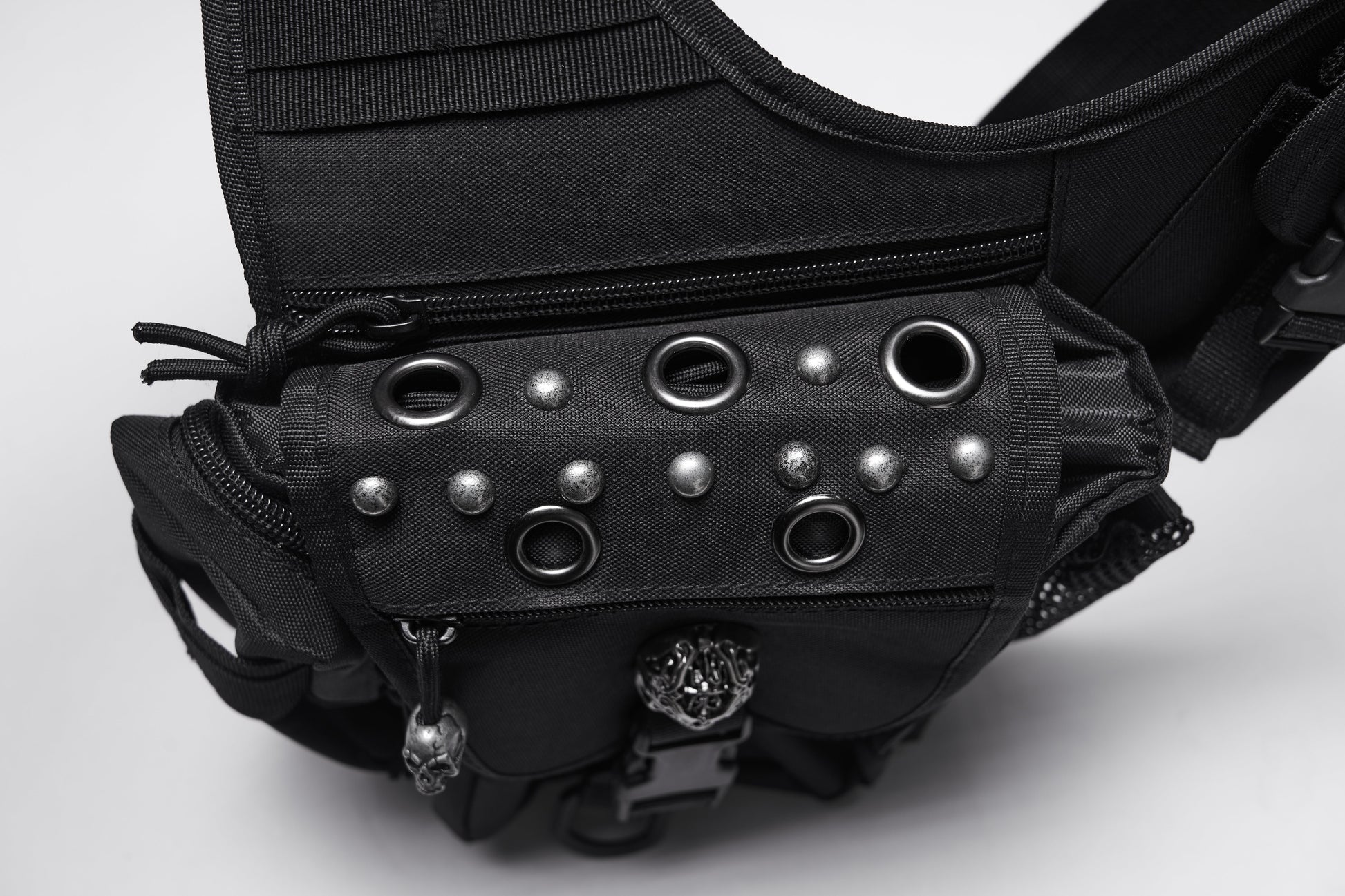 Luxury Punk Rave Tactical Goth Canvas Skull Waist-Leg Bag showcasing a rugged design with intricate skull emblems and multiple functional pockets, perfect for urban exploration and gothic fashion.