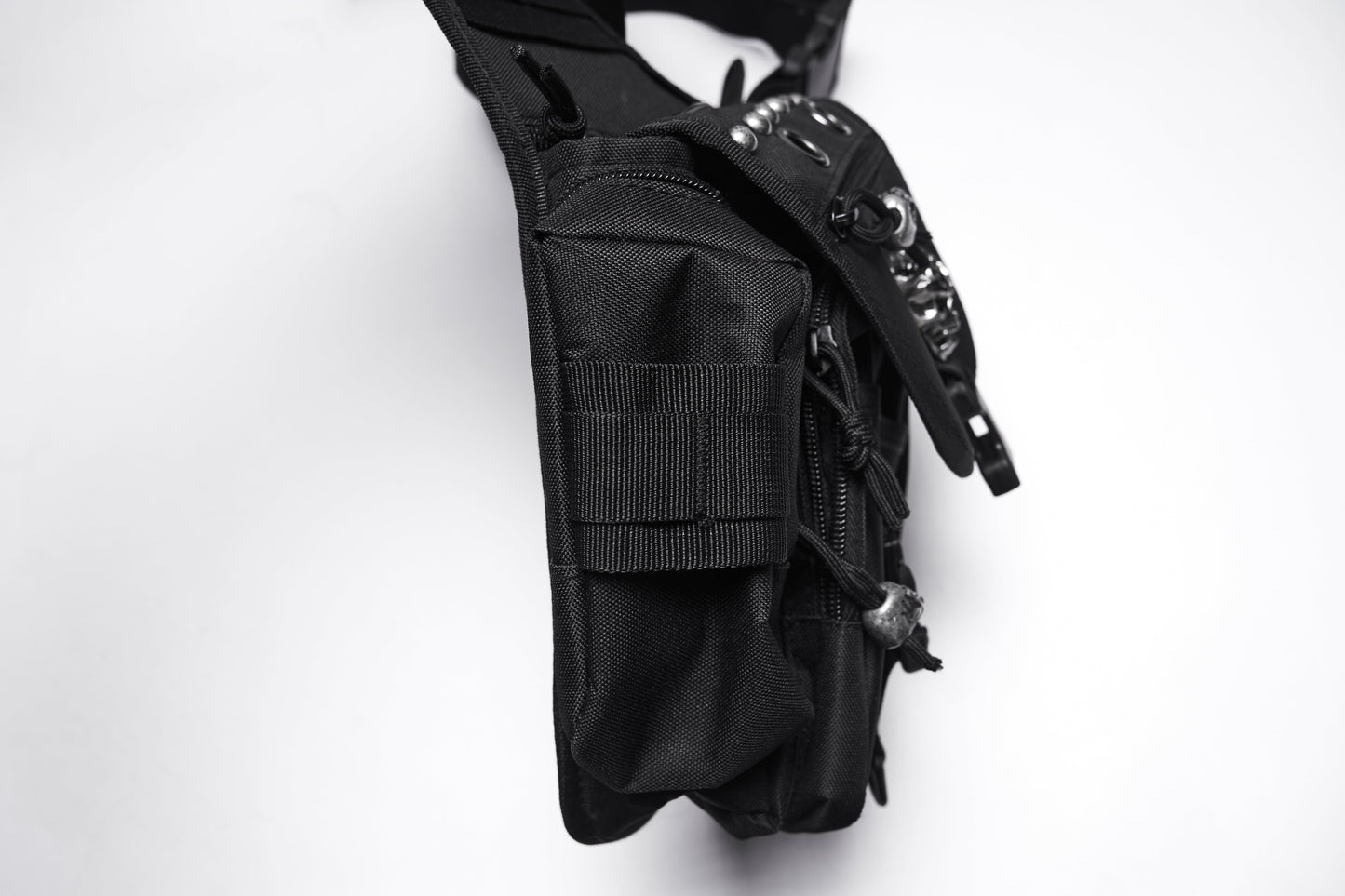 Close-up of the Punk Rave Tactical Goth Canvas Skull Waist-Leg Bag featuring heavy-duty rivets and a blend of punk aesthetics with practical storage, embodying luxury streetwear.