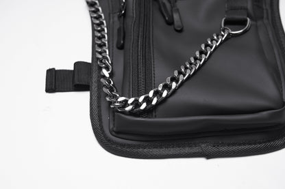 Side profile of the Punk Rave Cyberpunk Waist-Leg Bag, highlighting the rebellious industrial aesthetic with metal rivets and a stylish chain.