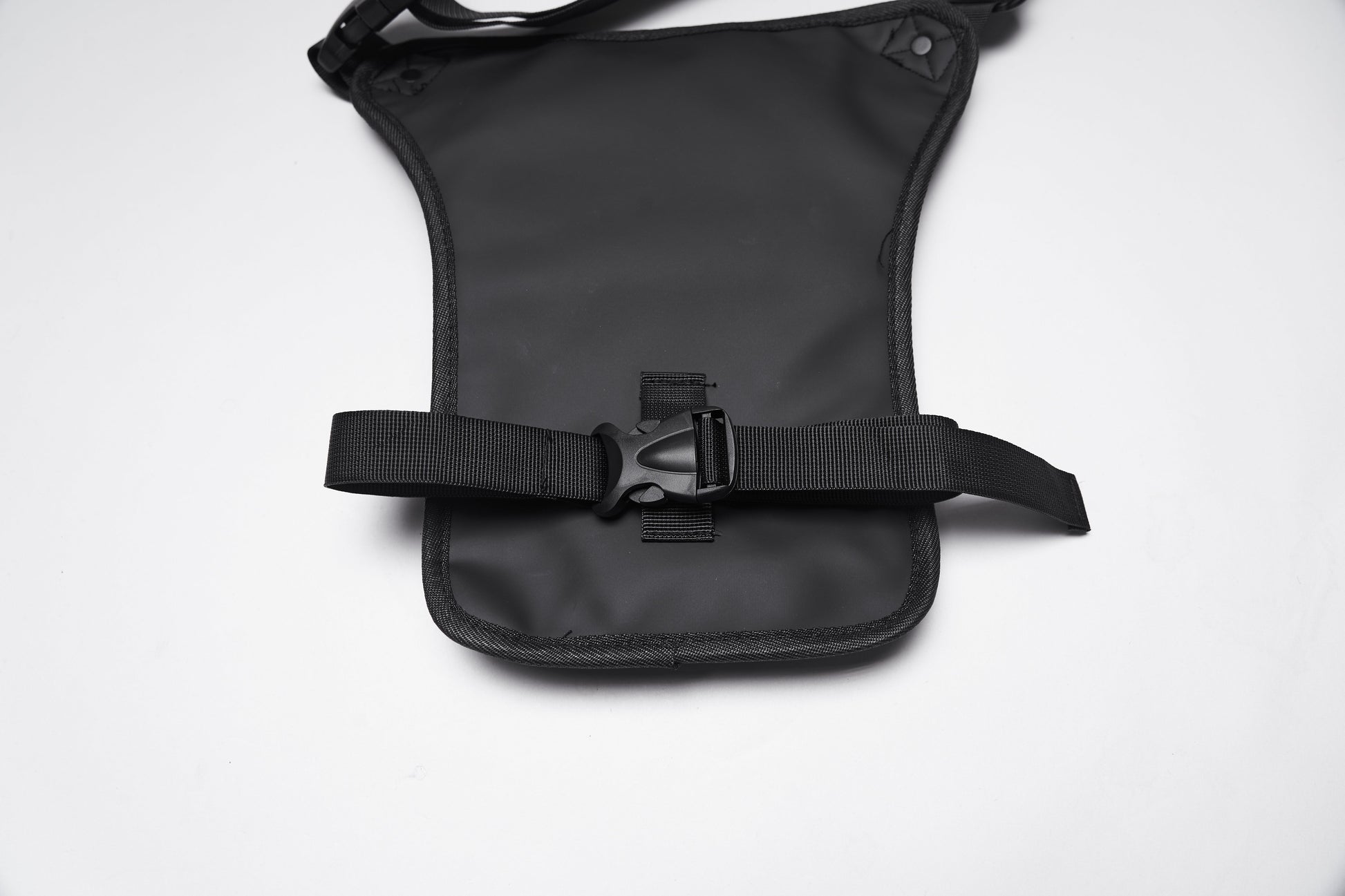 Close-up view of the Punk Rave Cyberpunk Waist-Leg Bag highlighting adjustable straps, spacious multi-pocket design, and bold industrial aesthetics for a luxurious yet rebellious style.