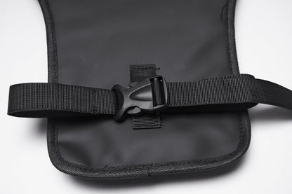 Stylish model displaying the Punk Rave Cyberpunk Waist-Leg Bag worn around the waist and thigh, combining utility and edgy fashion in a captivating urban setting.