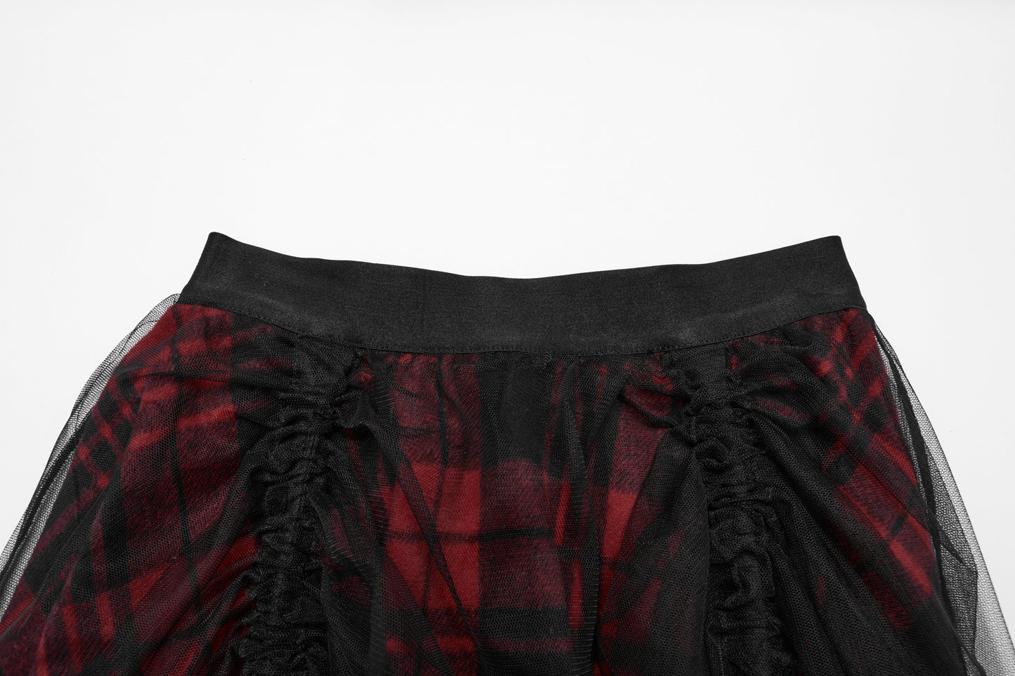 Luxurious Punk Rave Morrigan high-low skirt featuring vibrant red plaid fabric and elegant sheer black mesh overlay, showcasing a striking silhouette.