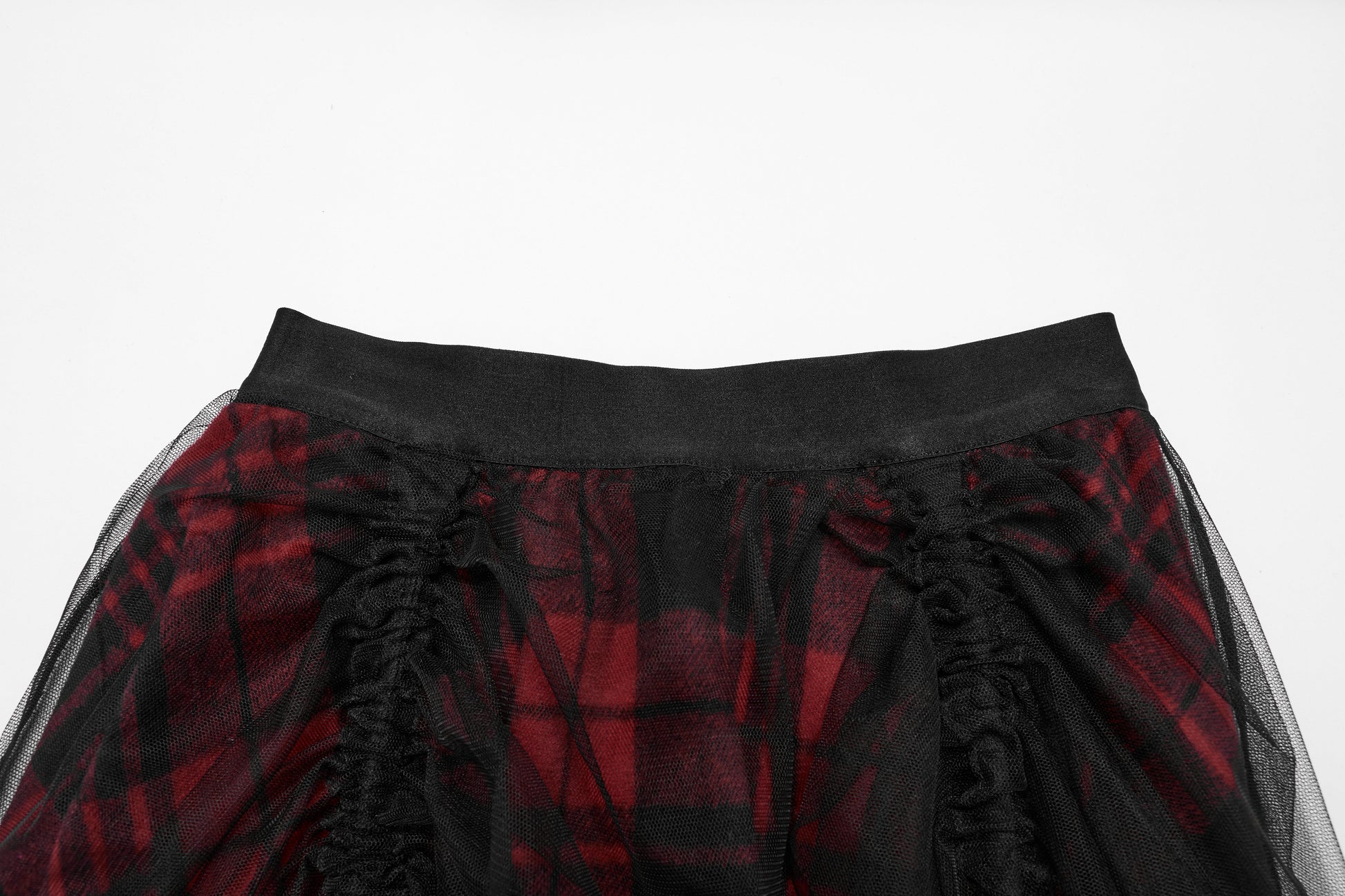 Luxurious Punk Rave Morrigan high-low skirt featuring vibrant red plaid fabric and elegant sheer black mesh overlay, showcasing a striking silhouette.