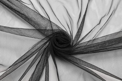 Model showcasing the Punk Rave Morrigan high-low skirt styled for a chic alternative outfit, blending punk and goth aesthetics beautifully.