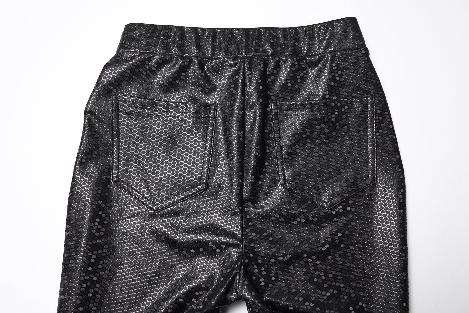 Detail shot of the Punk Rave Ravenna Leggings highlighting the back patch pockets and high-shine rubberized texture, perfect for adding sophistication to any outfit.