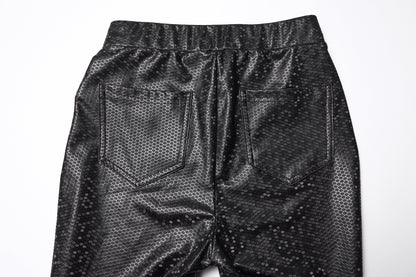 Detail shot of the Punk Rave Ravenna Leggings highlighting the back patch pockets and high-shine rubberized texture, perfect for adding sophistication to any outfit.