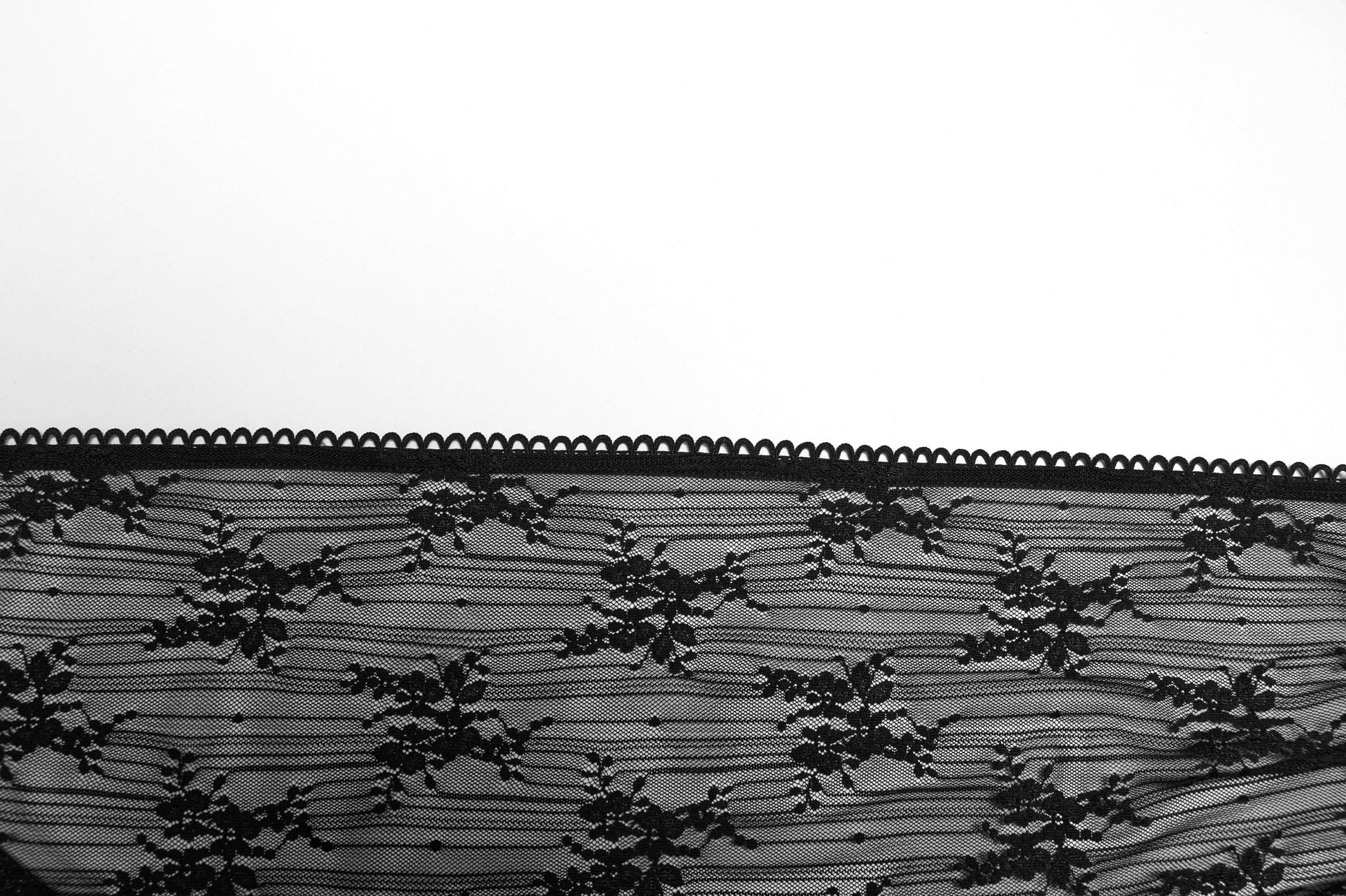 Punk Rave Tau Lace Cardigan in an outdoor setting, capturing its versatility as a stylish sun-protection piece ideal for luxe fashion enthusiasts.