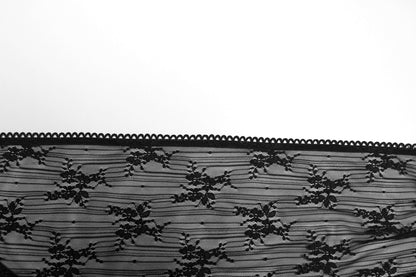 Punk Rave Tau Lace Cardigan in an outdoor setting, capturing its versatility as a stylish sun-protection piece ideal for luxe fashion enthusiasts.